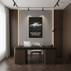 Modern office with a desk, chair, and framed poster of a 1989 BMW 325iS on the wall.